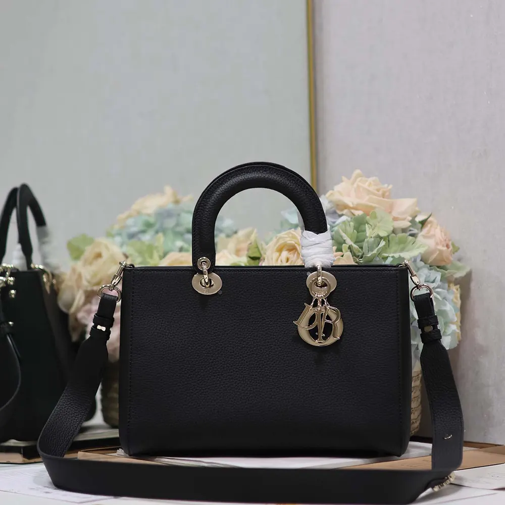 Side angle showing adjustable chain strap of Dior Women Medium Lady D-Sire bag