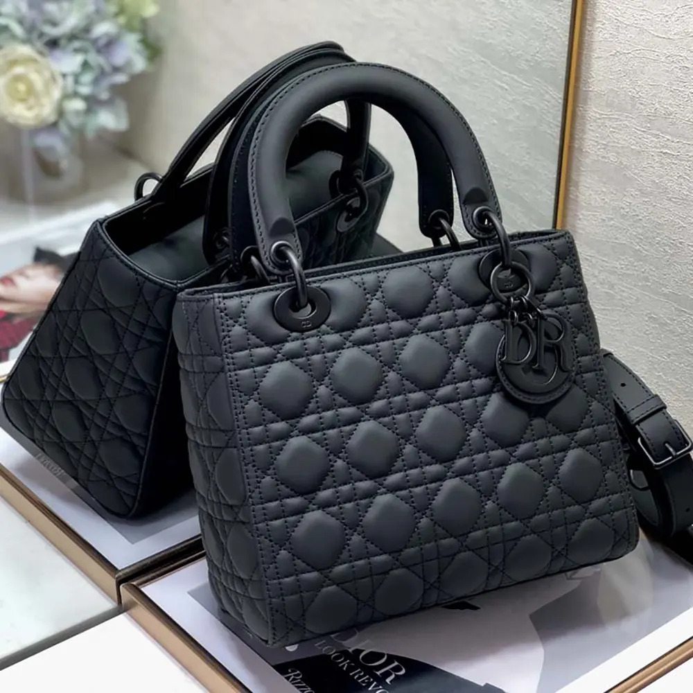 Close-up detail of black ultramatte Cannage quilting on Lady Dior bag