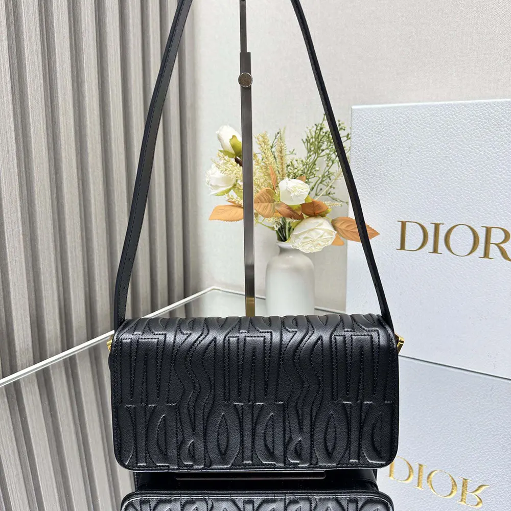 Side angle showing flap closure detail on Dior Women Miss Dior Flap Bag Black