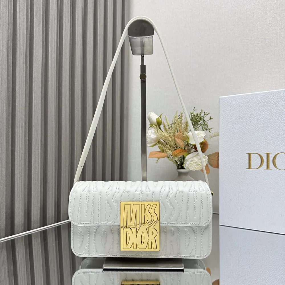 Close-up on quilting and silver hardware of Dior Women Miss Dior Flap Bag
