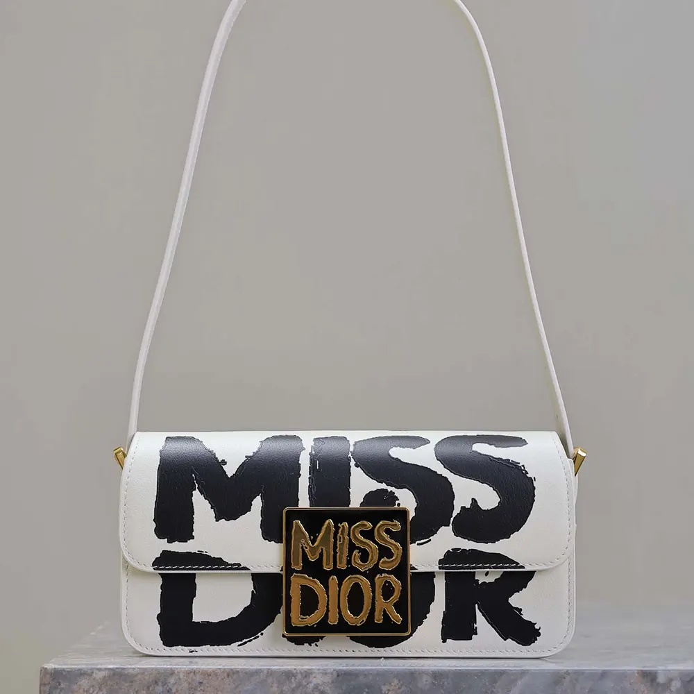 Close-up of silver hardware and flap closure on Miss Dior Graffiti Printed Calfskin bag