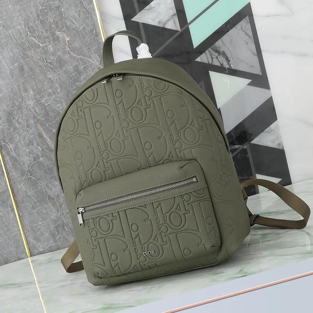 Close-up of zipped closure and silver hardware on Dior Unisex Rider 2.0 backpack