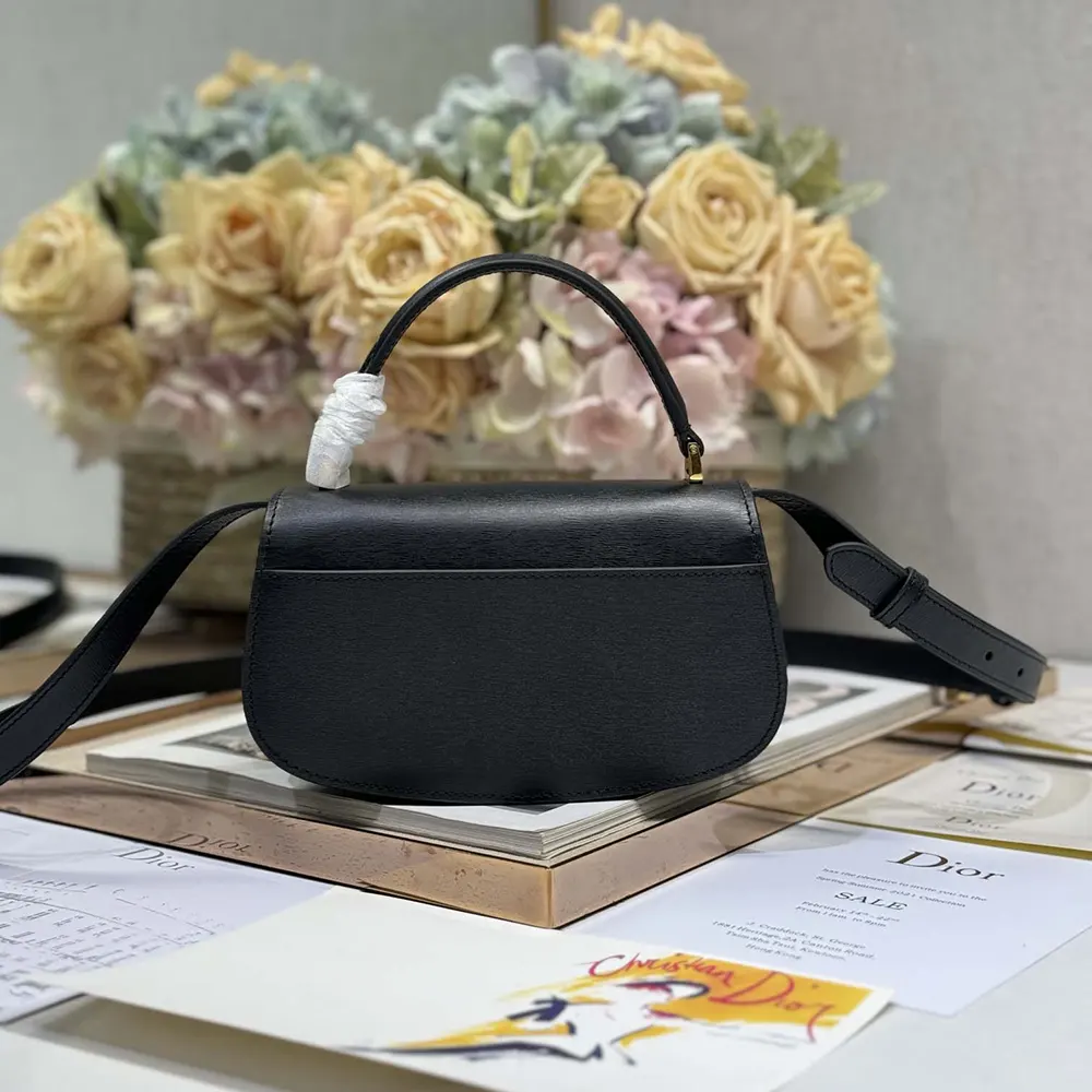 Side profile highlighting silhouette of Dior Women Small 30 Montaigne Avenue Top Handle Bag