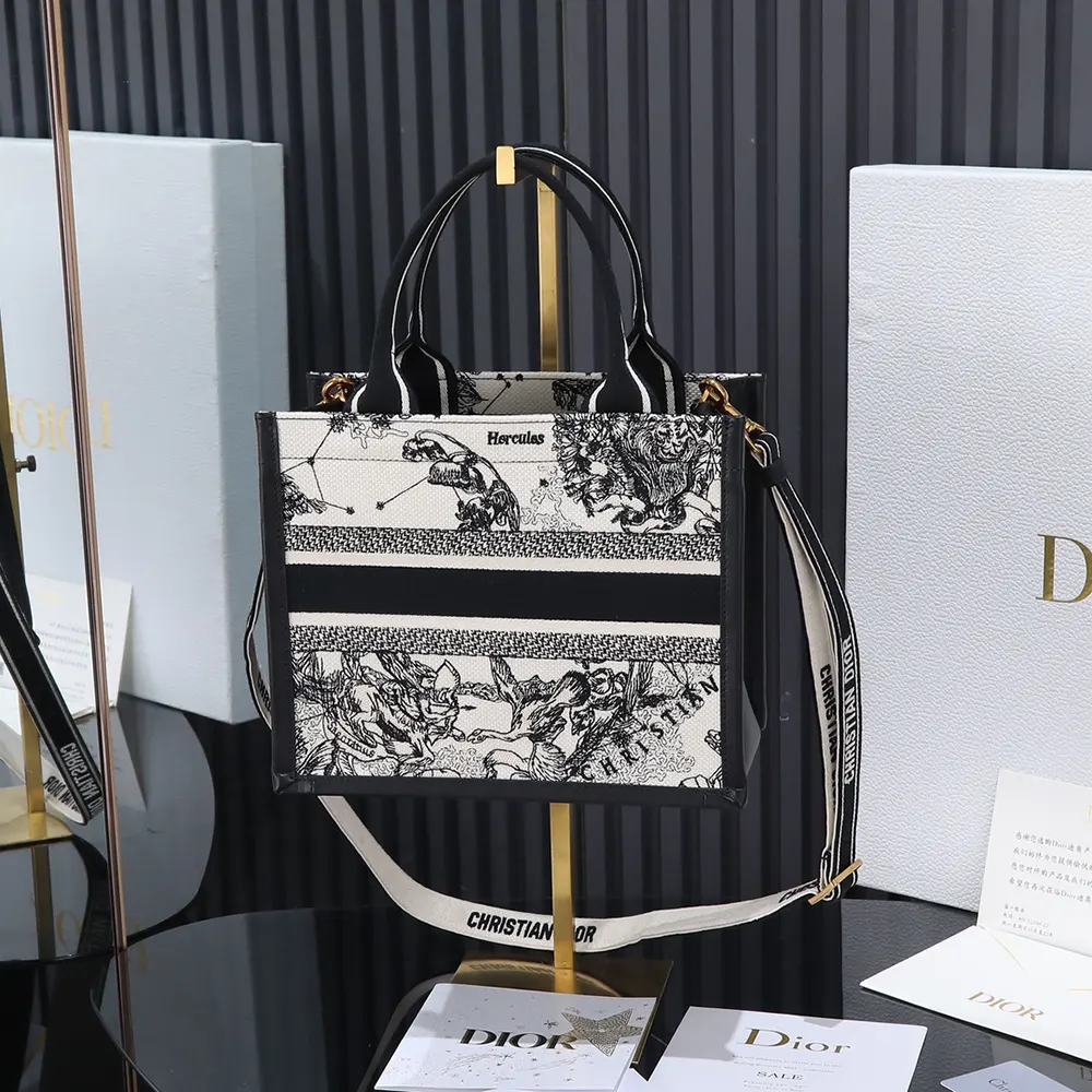 Side angle showing black calfskin and zipper closure of Dior Women Small Dior Book Tote