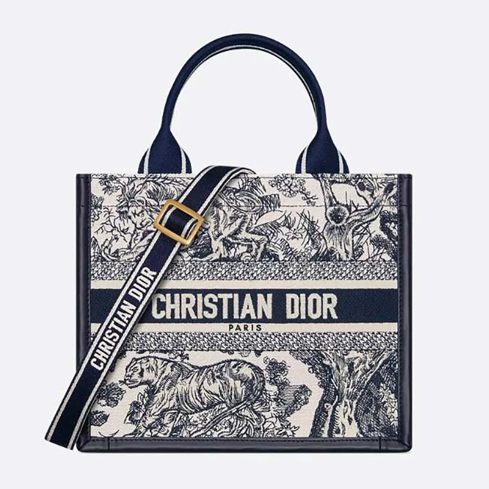 Front view of Dior Women Small Dior Book Tote White and Navy Blue Toile de Jouy Sauvage Embroidery