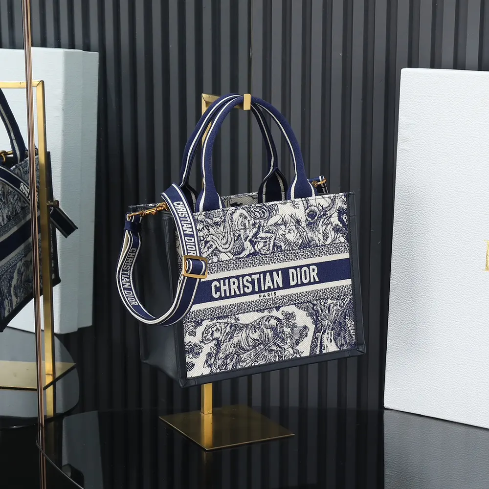 Close-up detail of navy and white embroidery on Dior Women Small Dior Book Tote
