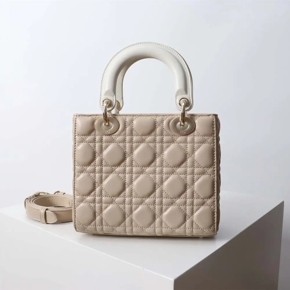 Side angle showing silver hardware and chain strap of Lady Dior bag