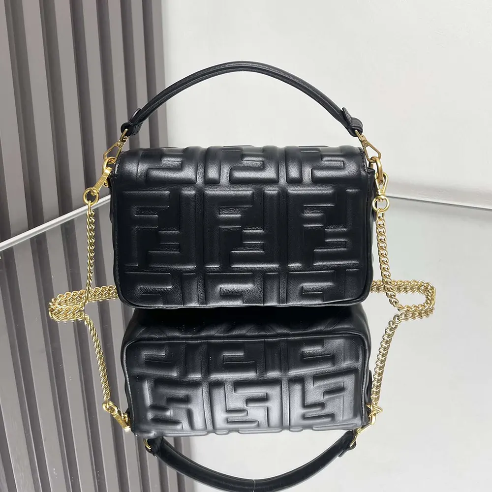 Side angle showing silhouette of Fendi Women Baguette Mini Black Leather Bag