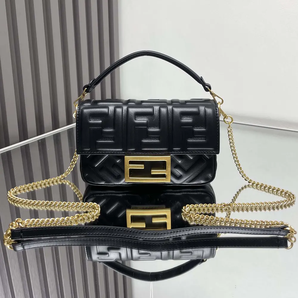 Close-up of FF motif hardware on Fendi Women Baguette Mini Black Bag