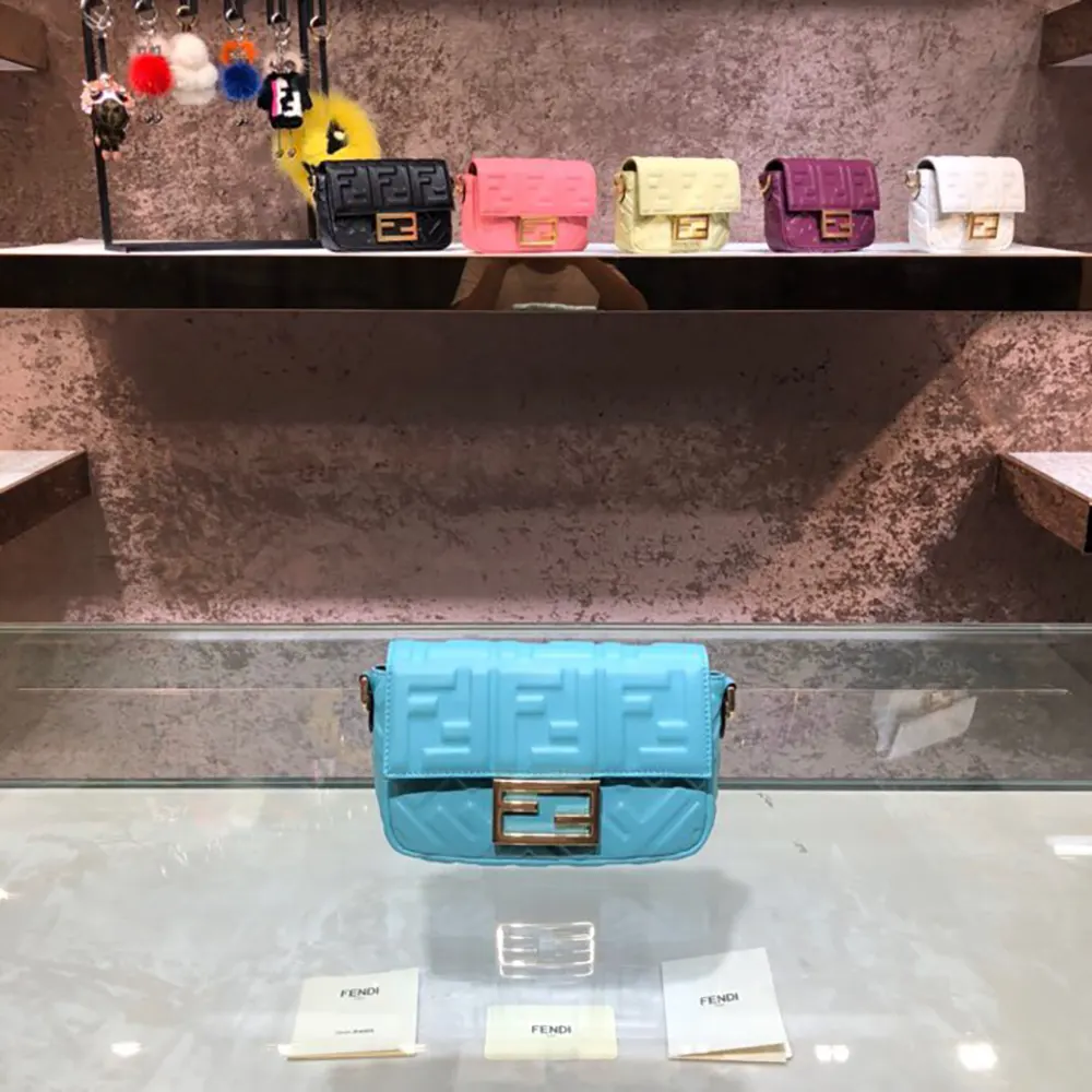 Close-up of FF motif clasp on Fendi Women Baguette Mini Blue Bag