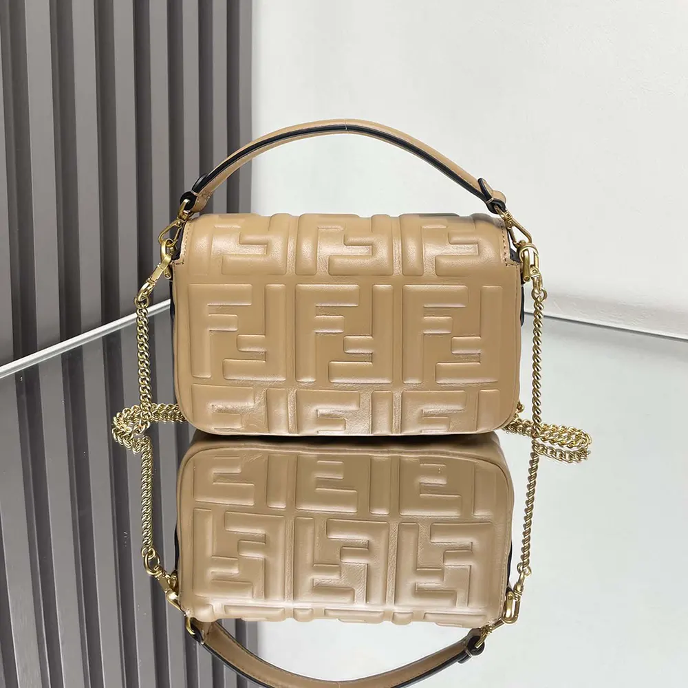 Side angle showcasing silhouette of Fendi Women Baguette Mini Dove Gray Nappa Leather Bag