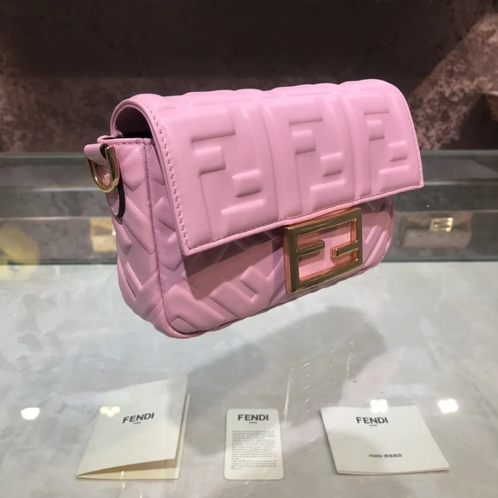 Side angle showing compact shape of Fendi Women Baguette Mini Pink Nappa Leather Bag