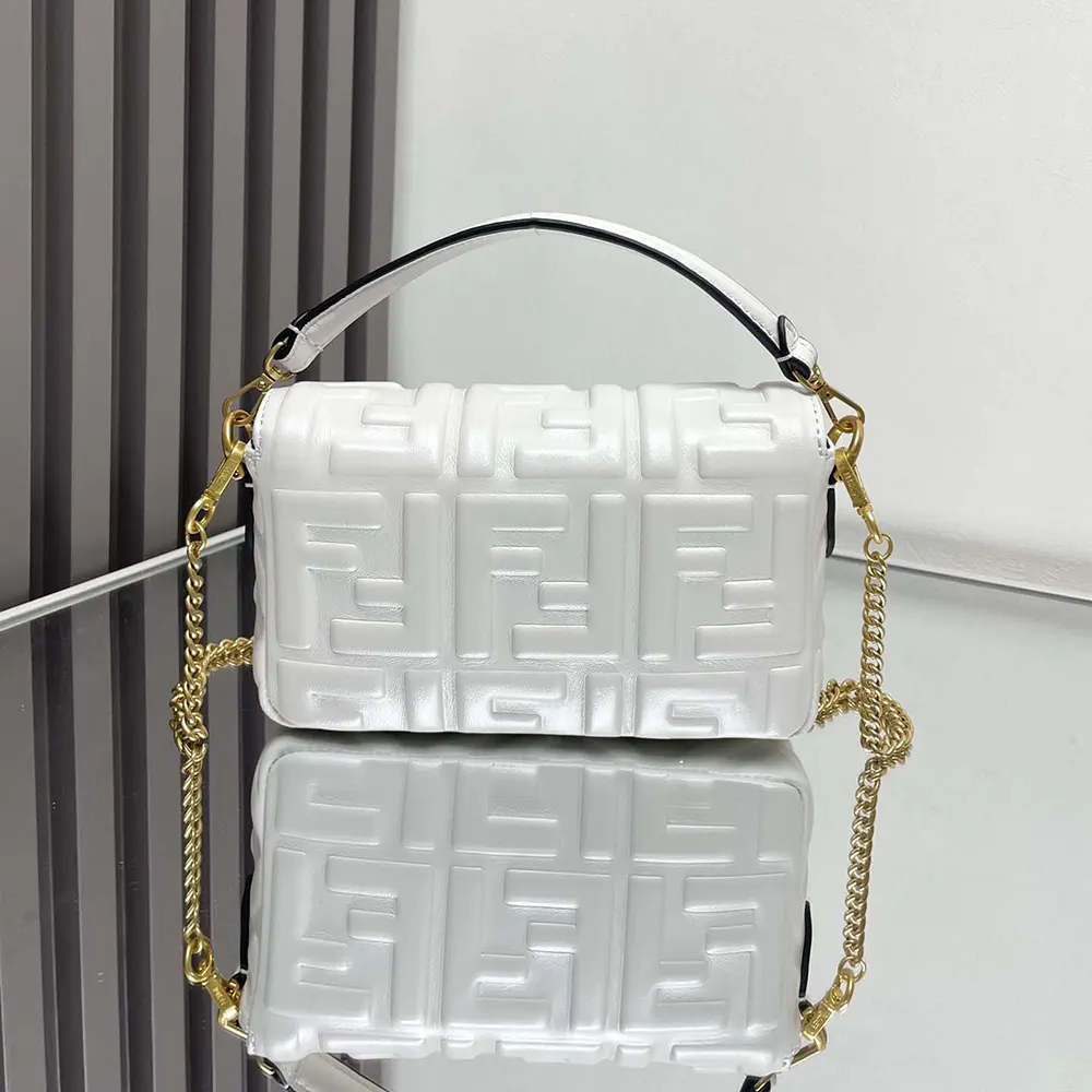 Side angle showing compact silhouette of Fendi Women Baguette Mini White Bag