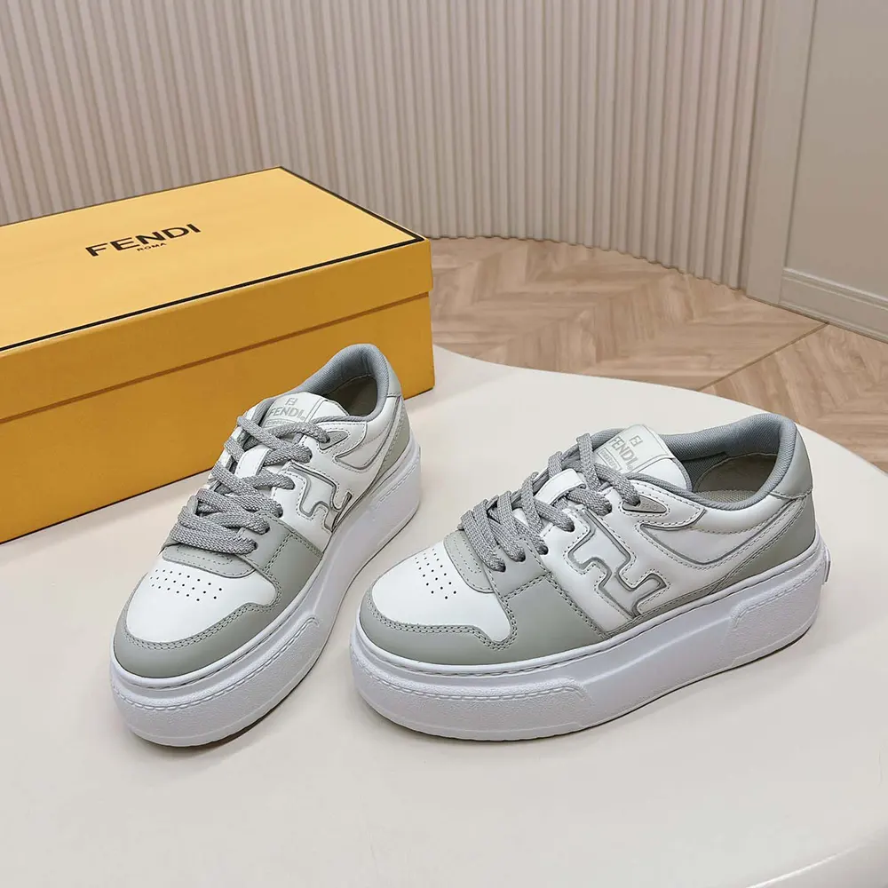Overhead shot showing lace-up closure and gray leather texture of Fendi low-tops