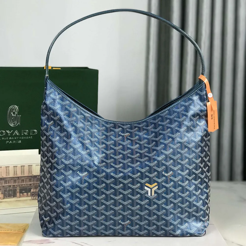 Close-up detail of Goyard coated canvas and silver hardware