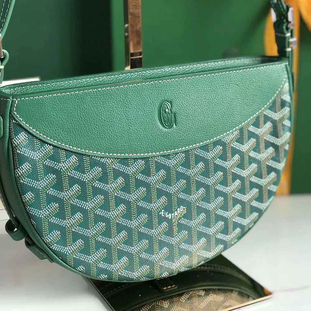 Side angle showing adjustable strap and silver hardware of Hirondelle Bag