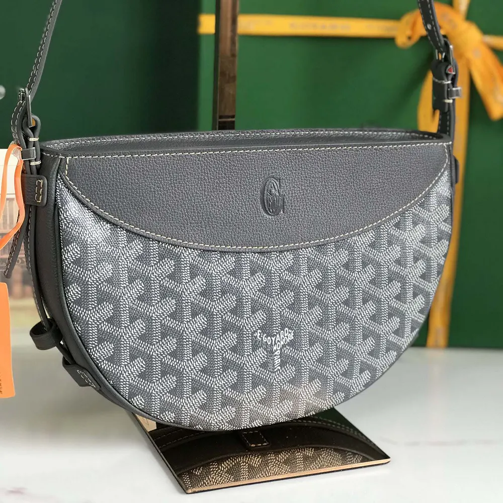 Side profile detail of brass hardware on Goyard Unisex Hirondelle Bag-Grey