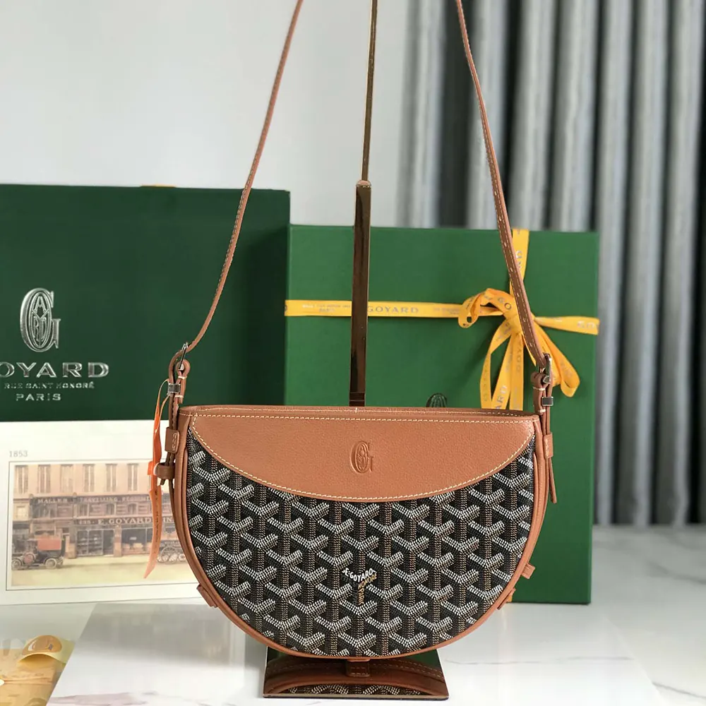 Close-up of tan leather trim and gold hardware on Goyard Unisex Hirondelle Bag-Tan