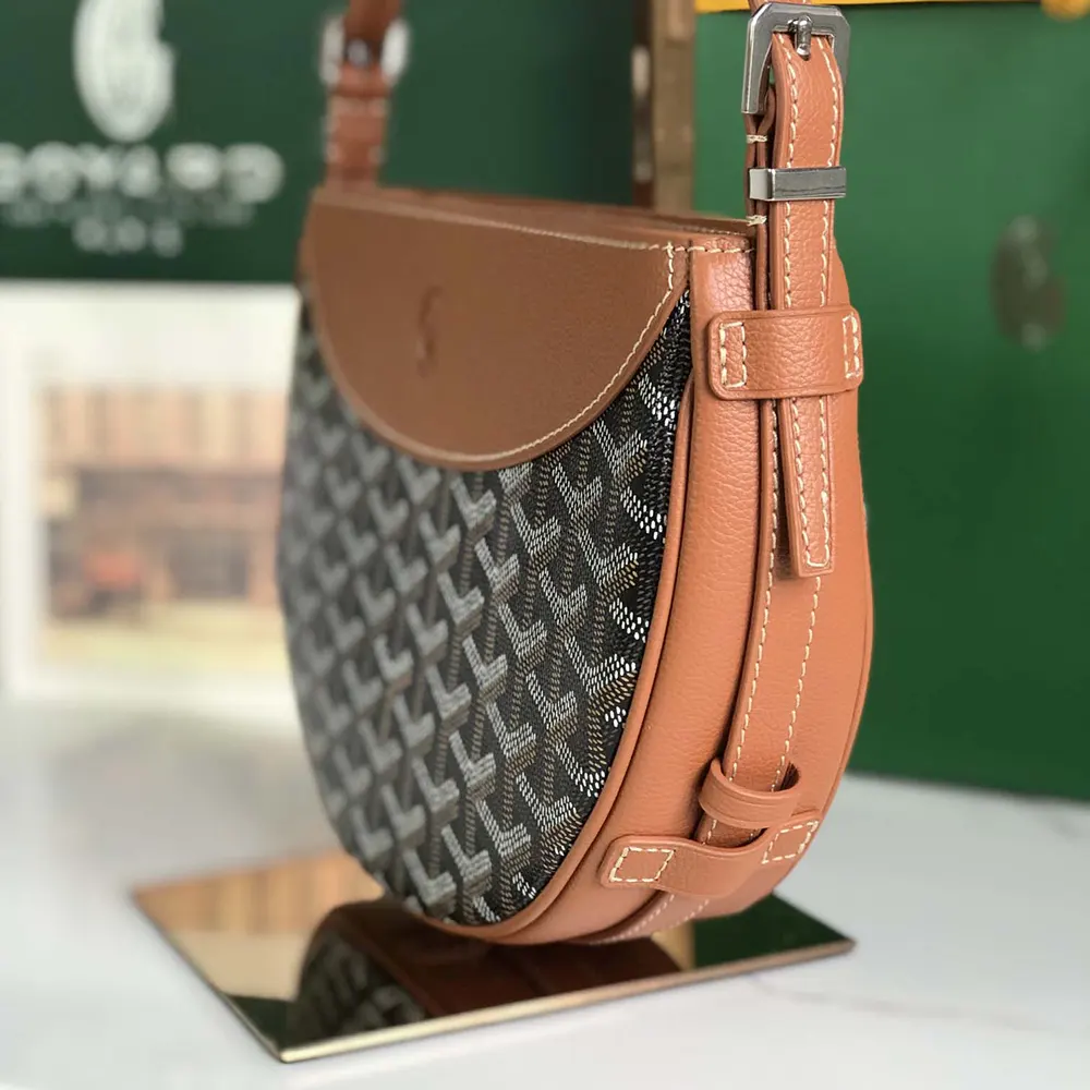 Side angle of Goyard Unisex Hirondelle Bag-Tan highlighting structured silhouette