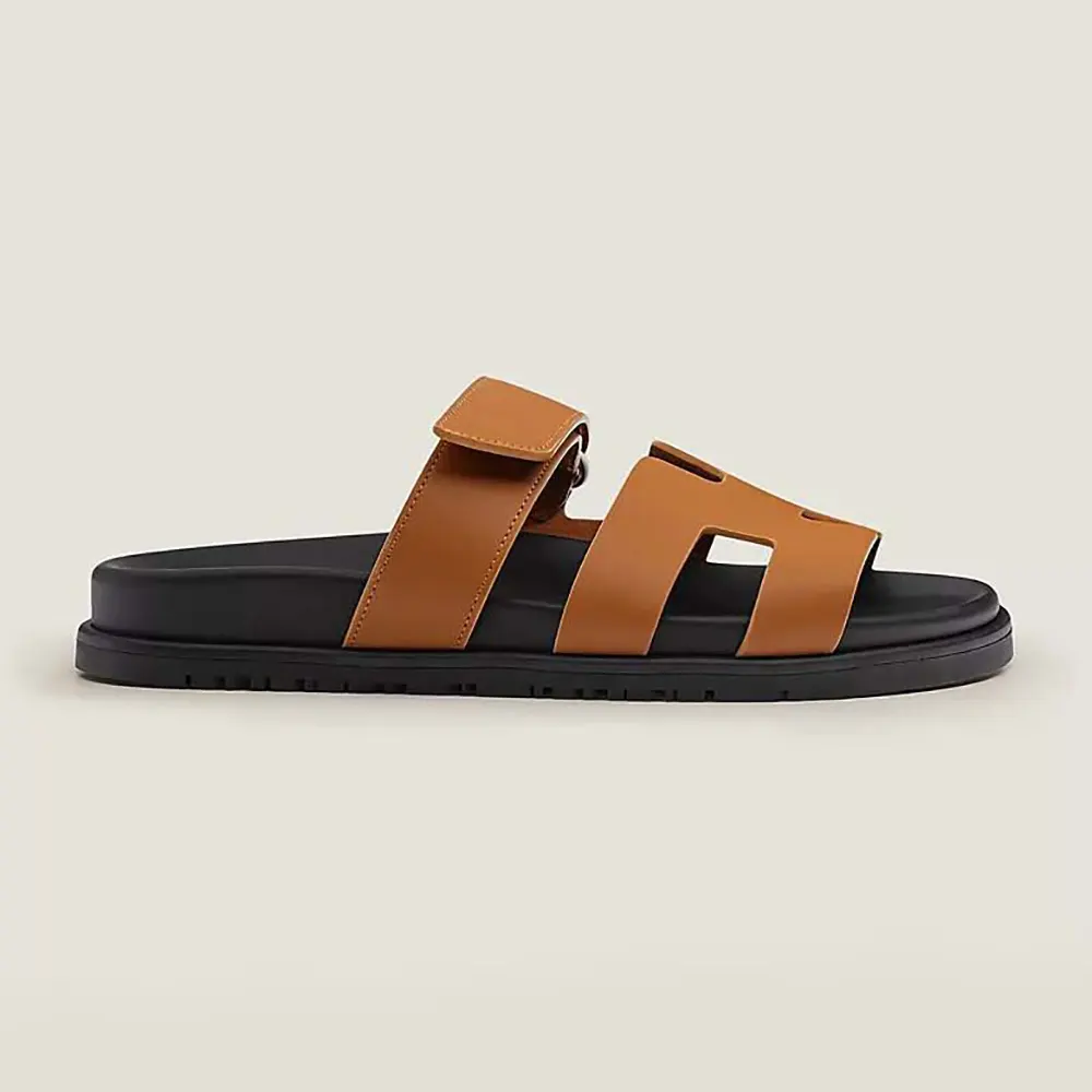 Side view of Hermes Unisex Chypre Sandal-Brown showing silhouette