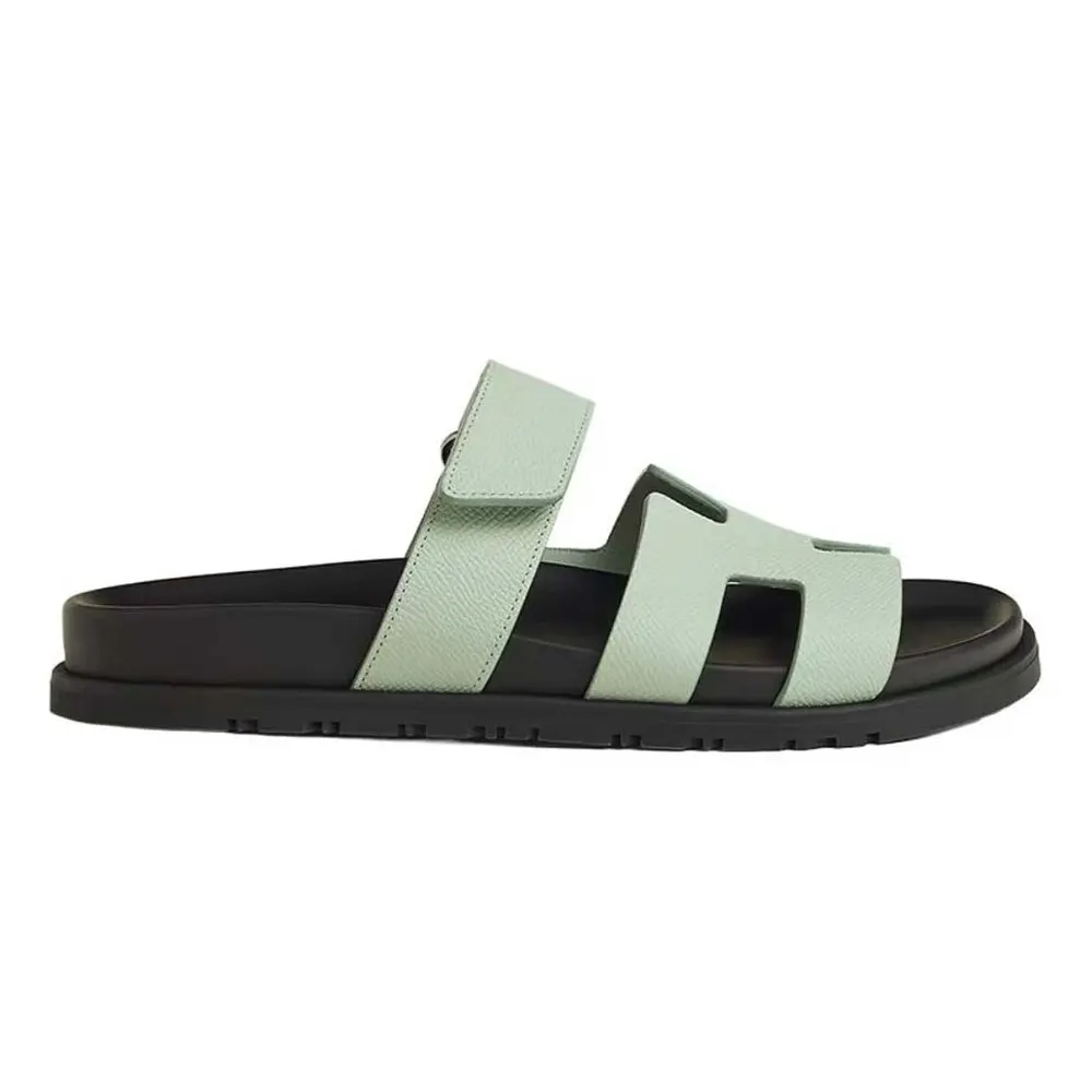 Side view of Hermes Unisex Chypre Sandal-Light Green leather strap