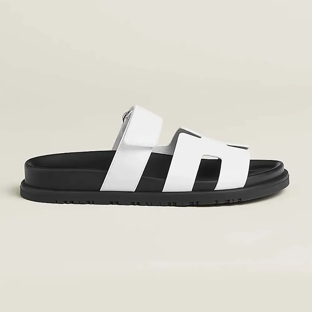 Side view of Hermes Unisex Chypre Sandal-White showing sleek silhouette