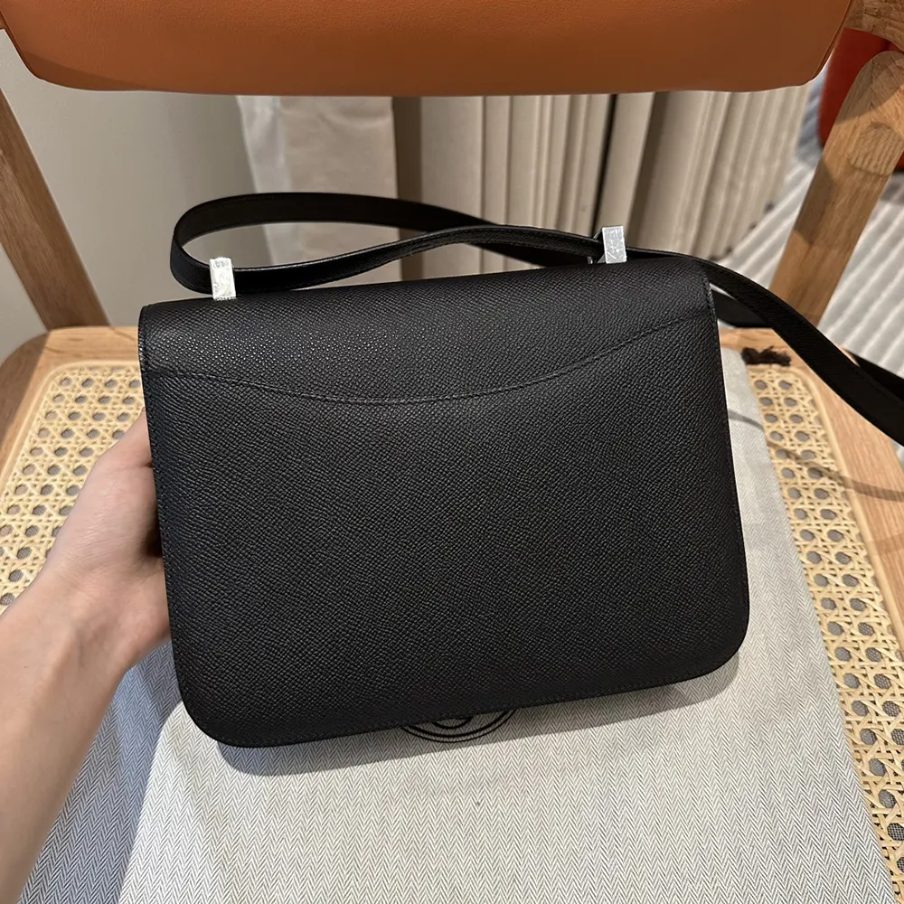 Side angle showing texture of Epsom leather on Hermes Women Constance 24 Bag