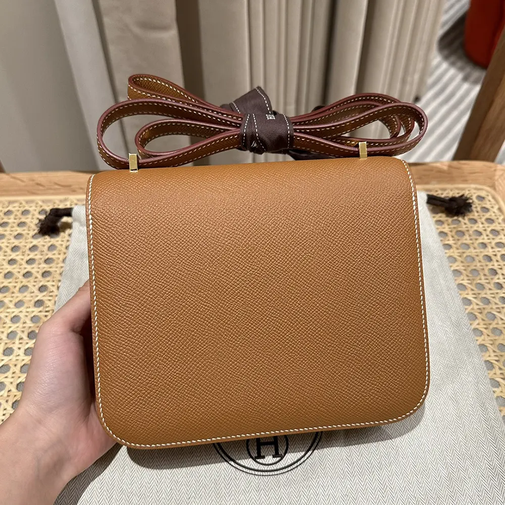 Side angle showing brown Epsom leather texture of Hermes Women Constance 24 Bag