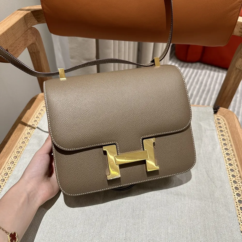 Close-up of gold H clasp on Hermes Women Constance 24 Bag