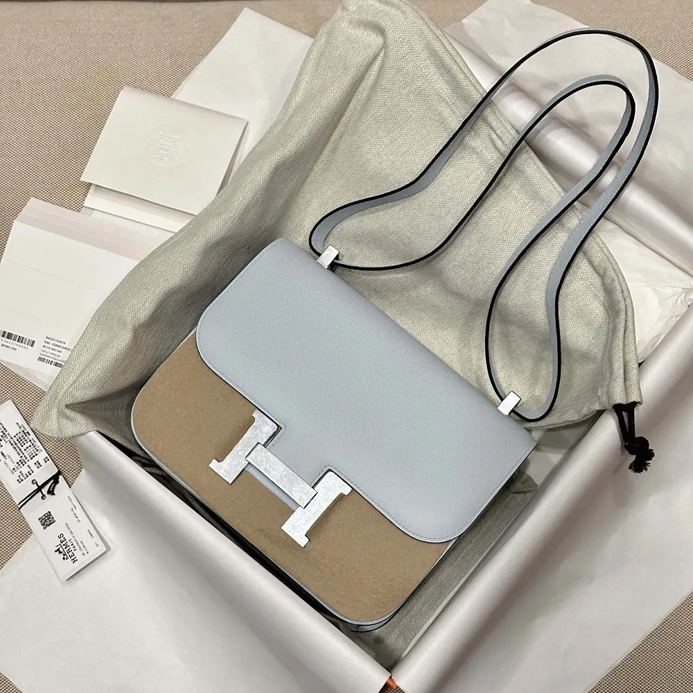 Side angle of Hermes Women Constance 24 Bag in light blue Epsom leather