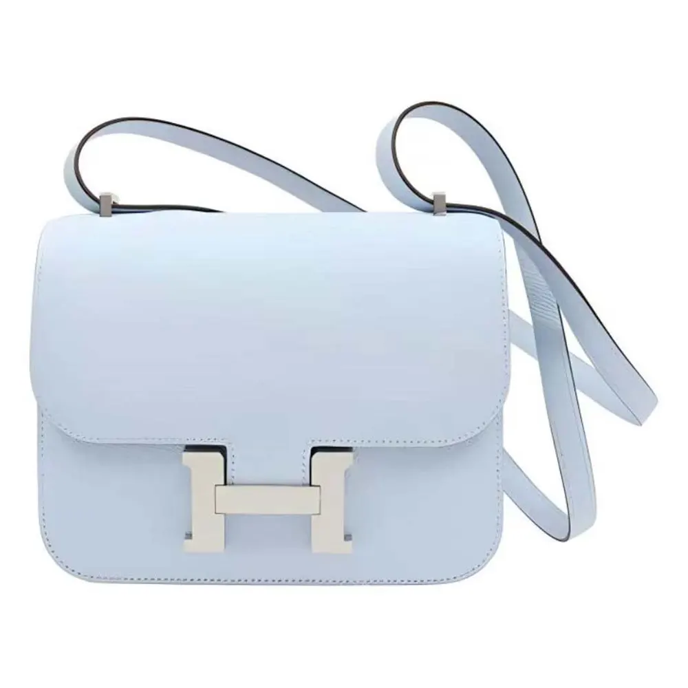 Front view of Hermes Women Constance 24 Bag Light Blue showing silver clasp