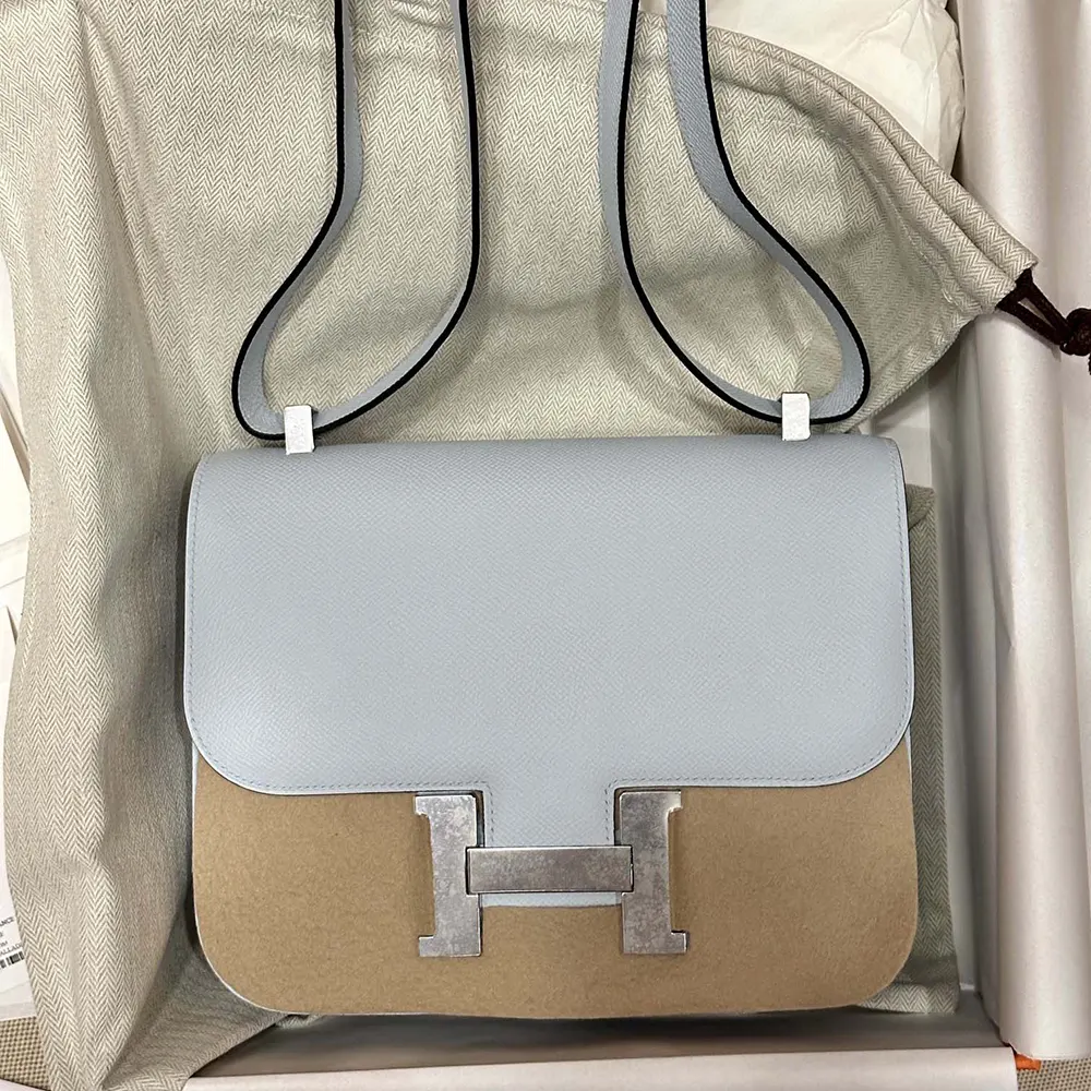 Close-up on silver ‘H’ clasp of Hermes Women Constance 24 Bag