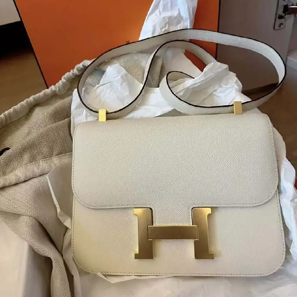 Close-up of gold H clasp on Hermes Women Constance 24 Bag