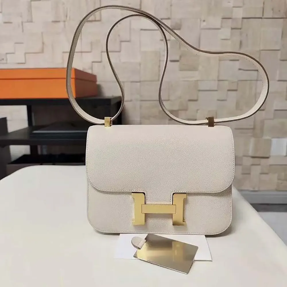 Side angle showing slim silhouette of Hermes Women Constance 24 Bag