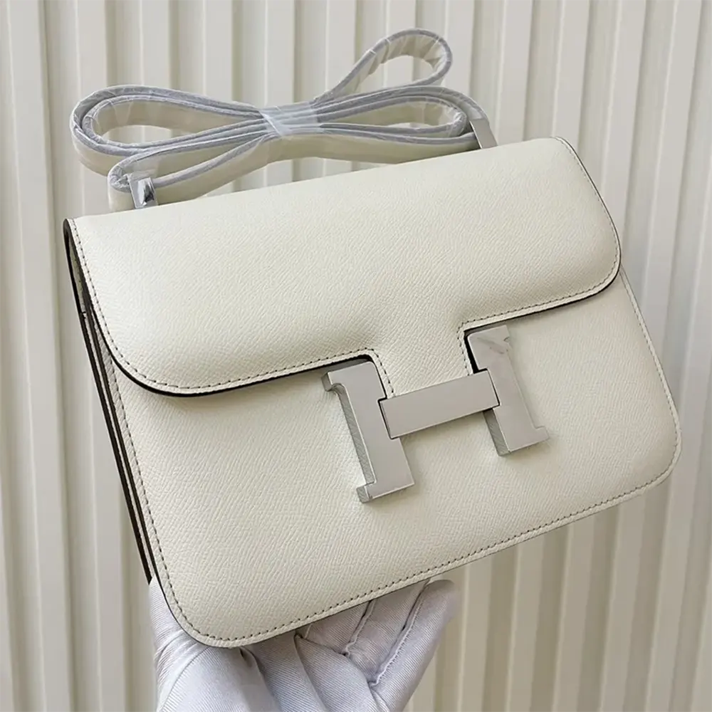 Side angle showing textured Epsom leather of Hermes Women Constance 24 Bag