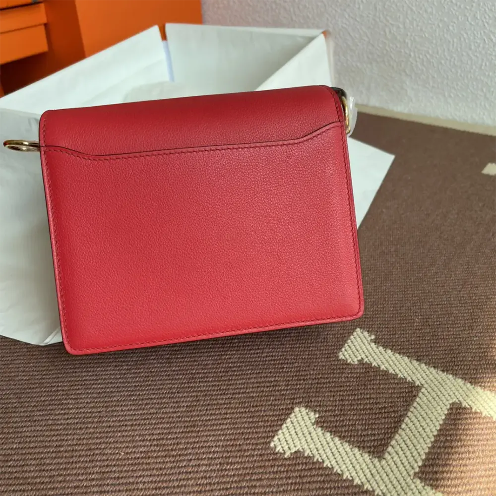 Close-up of gold 'H' clasp detail on Hermes Women Roulis Mini Bag