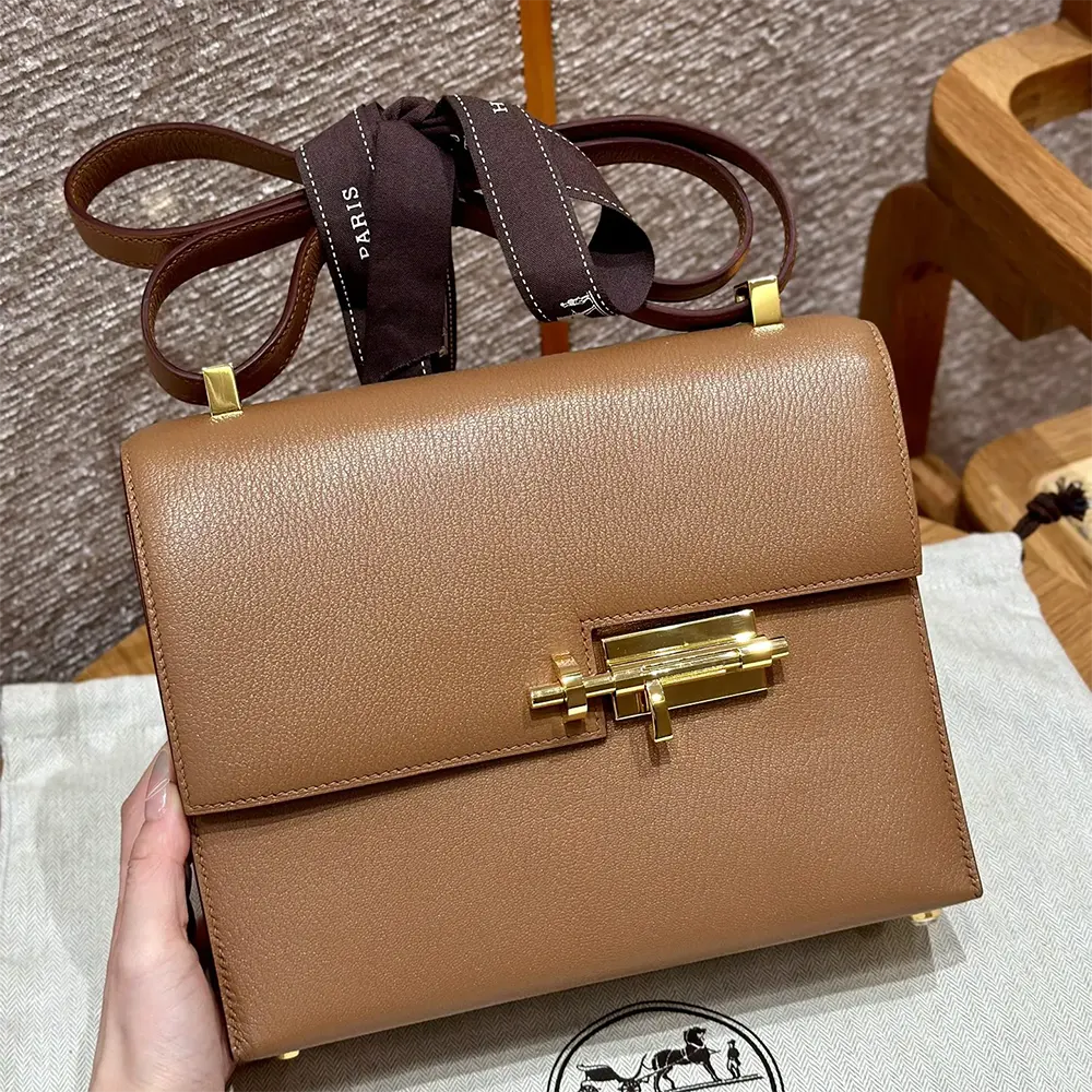 Front angle of Hermes Women Verrou 21 Bag in brown Togo leather