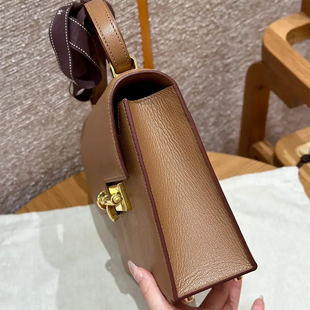 Side profile showing slim silhouette of Hermes Women Verrou 21 Bag