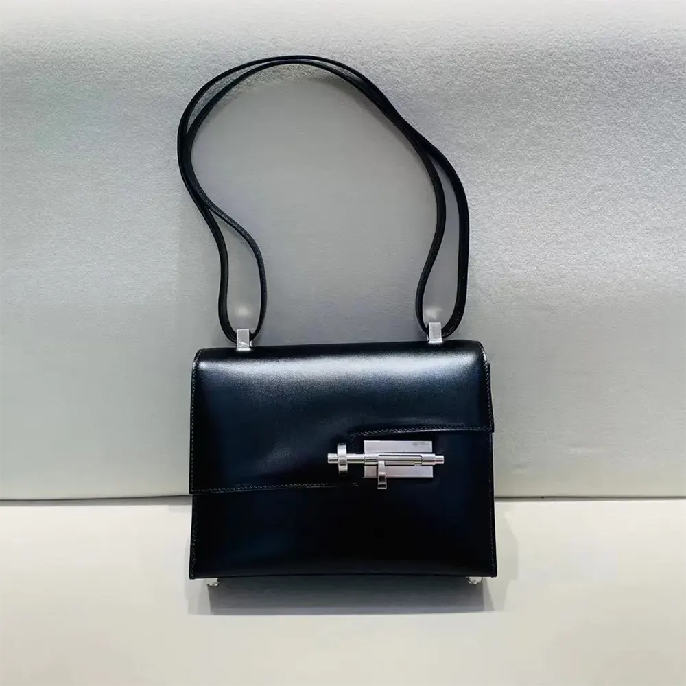 Side angle showing structured shape of Hermes Women Verrou Bag