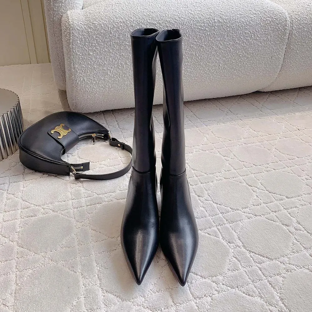 Close-up of inner zip and leather texture on Jimmy Choo Cycas boots