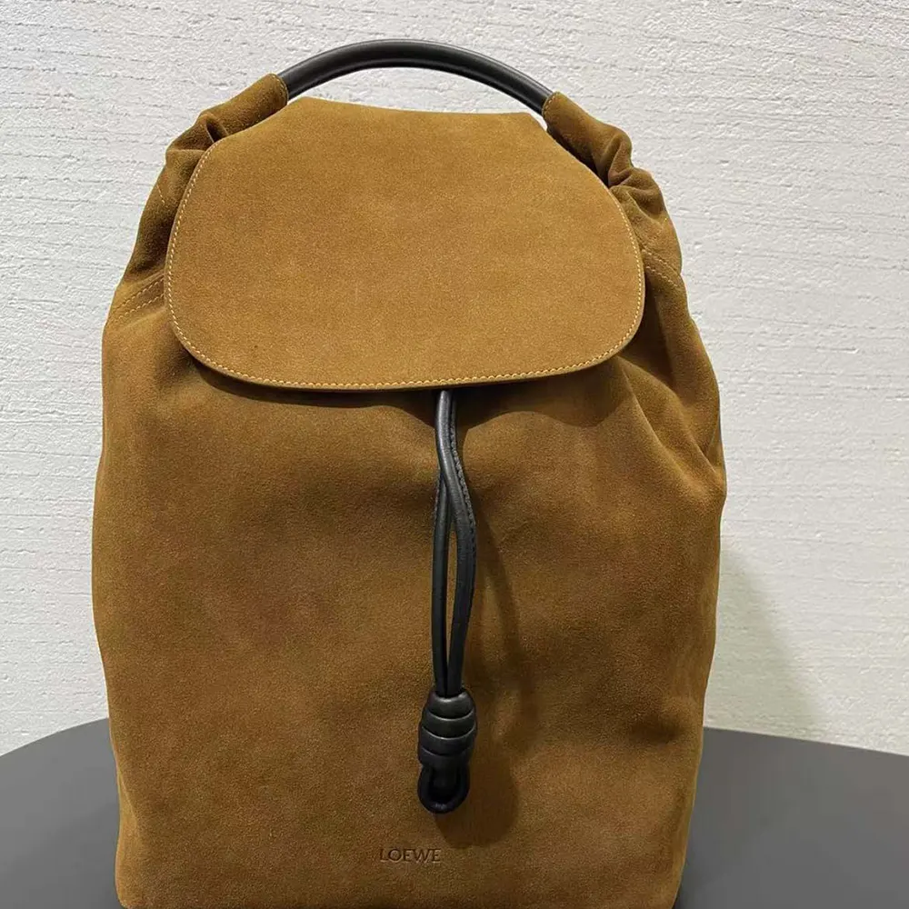 Side angle showing silhouette and leather straps of Loewe Unisex Flamenco Backpack
