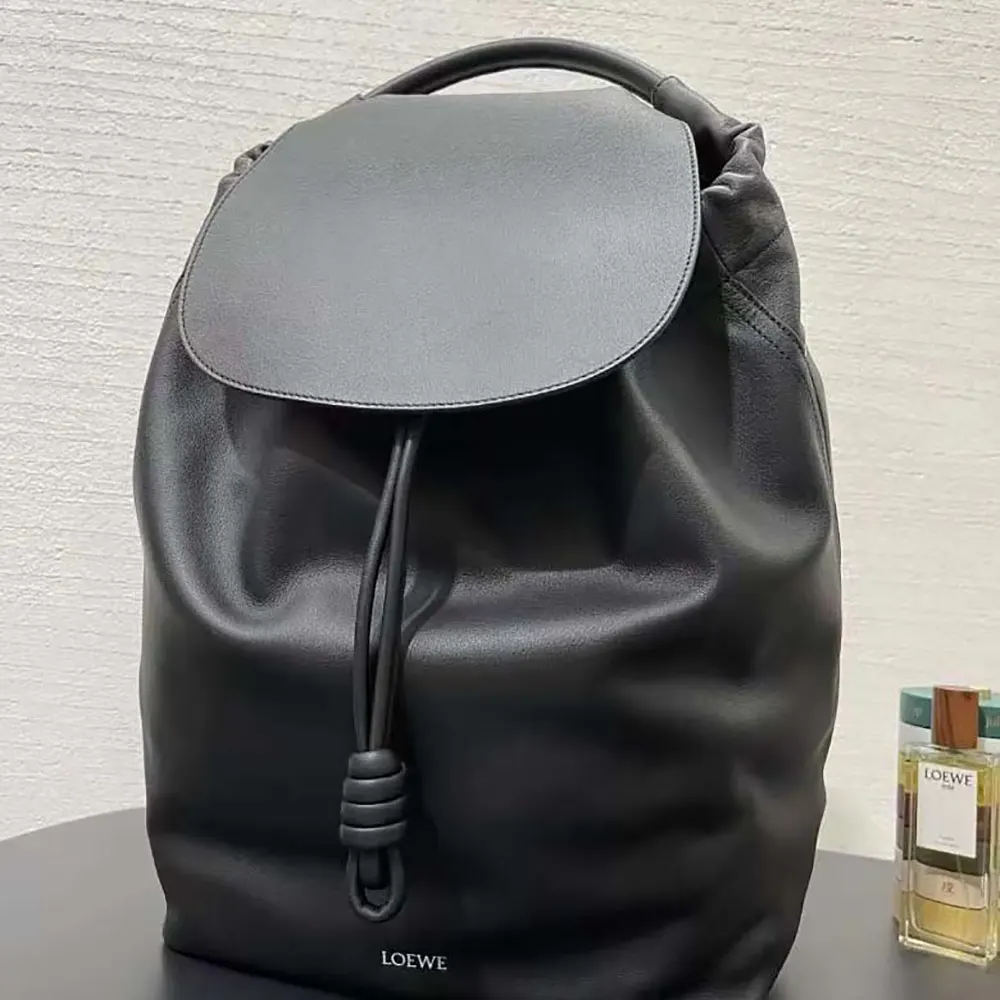 Side profile showing straps and sleek silhouette of Loewe Flamenco Backpack