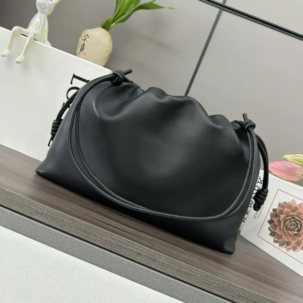 Side angle showing supple leather texture of Loewe Large Flamenco Purse