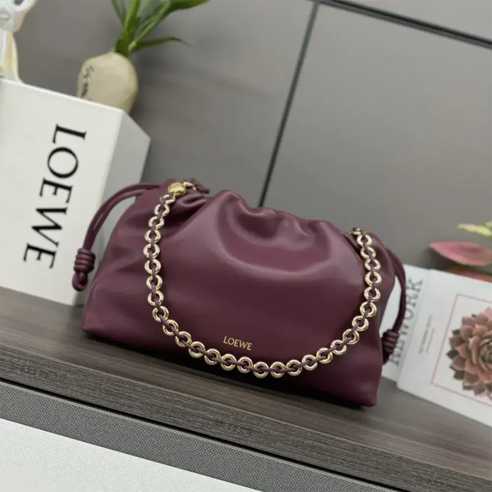 Side profile showing curved silhouette of Loewe Unisex Medium Flamenco Purse