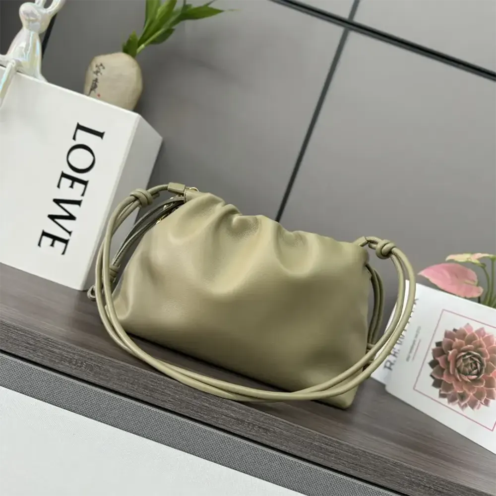 Side angle showing antique gold hardware on Loewe Medium Flamenco Purse