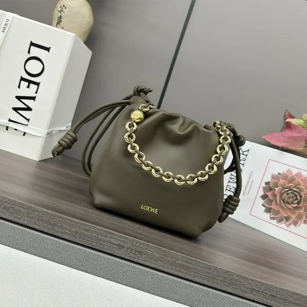 Close-up of gold-tone hardware and gathered lambskin detail on Loewe Mini Flamenco
