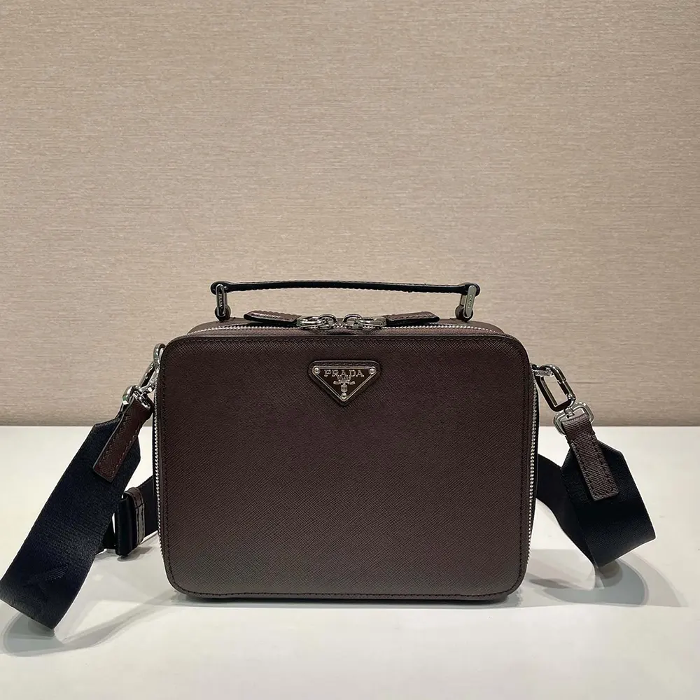 Close-up on silver hardware and Prada logo on Prada Men Medium Prada Brique bag