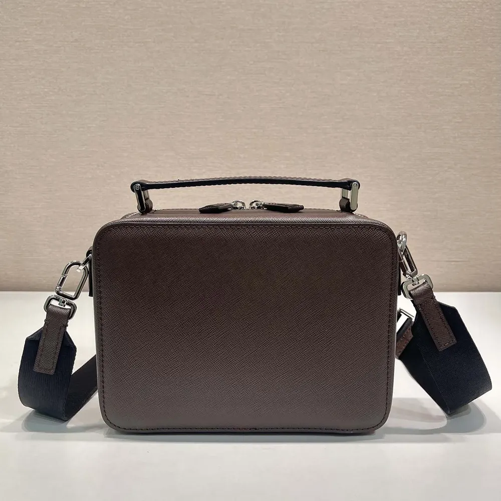 Profile showing the compact silhouette of Prada Men Medium Prada Brique Leather Bag