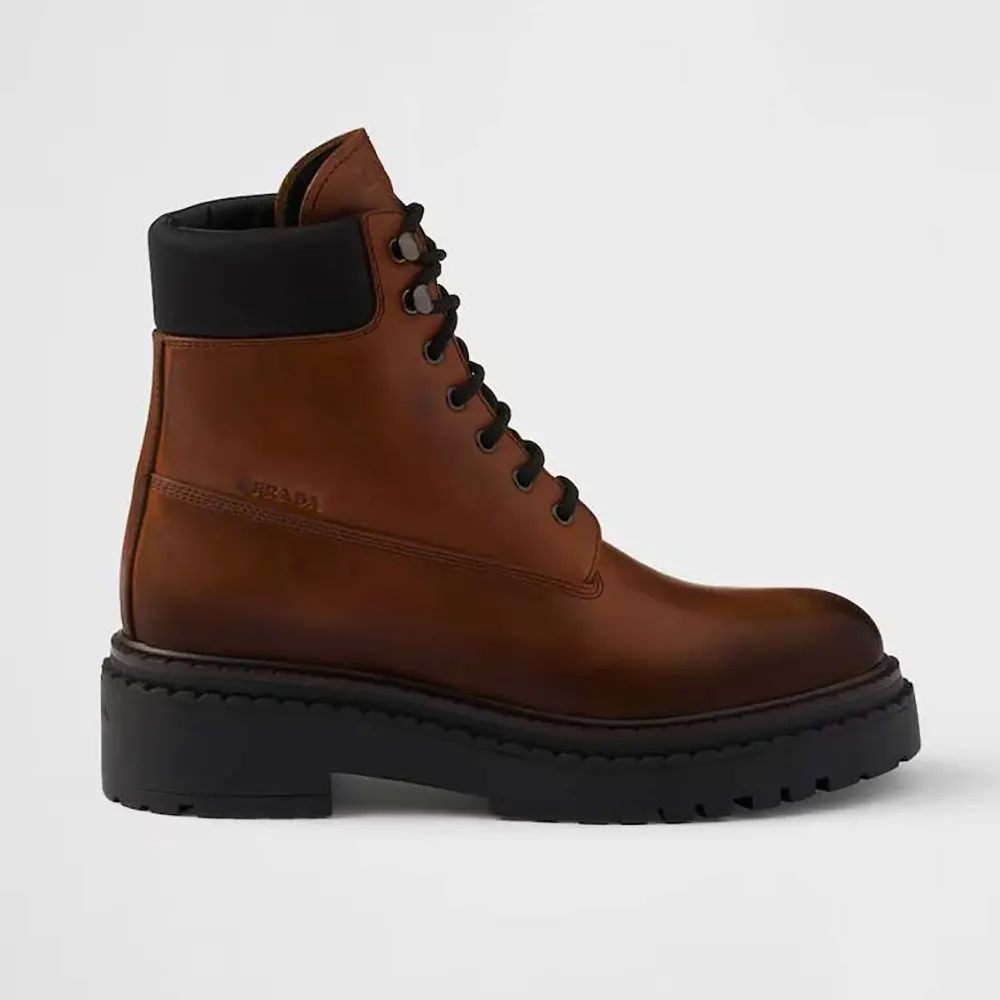 Front angle of Prada Unisex Leather and Re-Nylon booties-Ebony showing laces