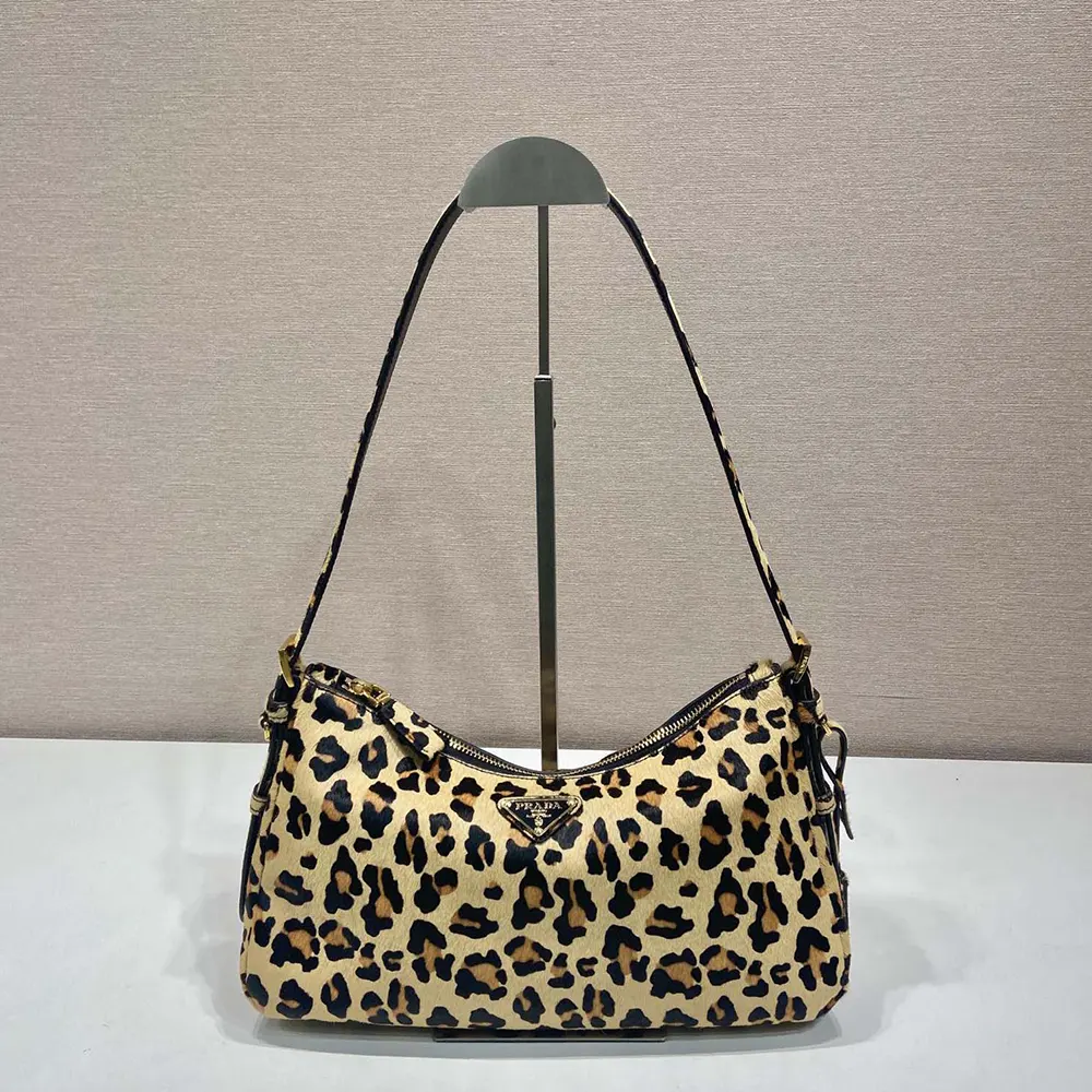 Side angle showing brown printed leather texture of Prada Women Aimèe bag